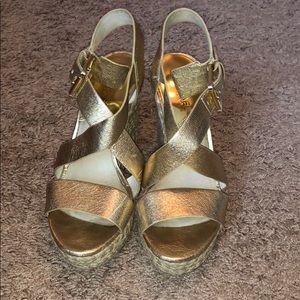 Women’s size 7.5 Michael Kors gold wedges
